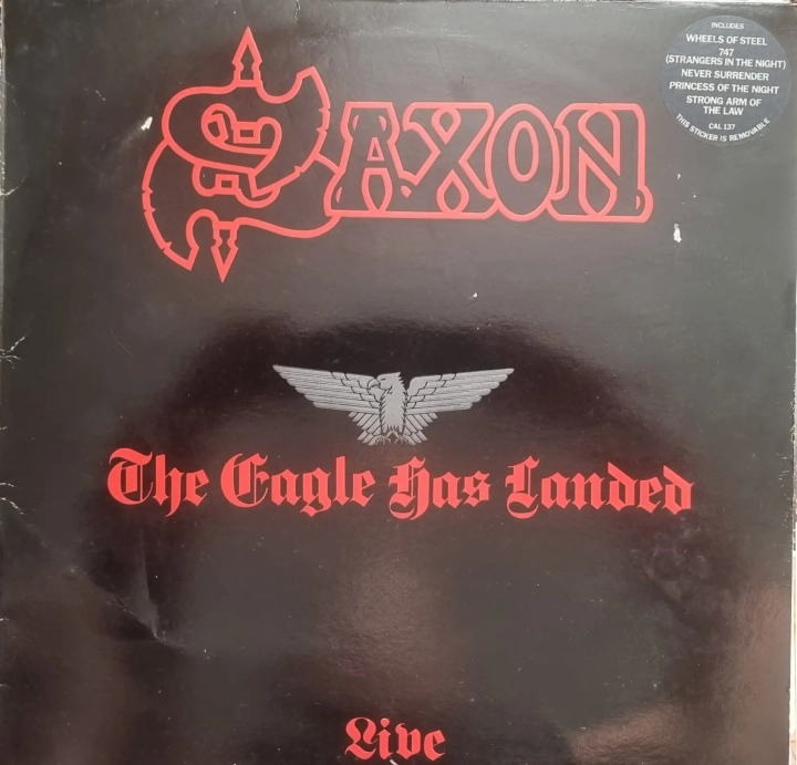 Saxon--The-Eagle-Has-Landed-Live-Carrere--CAL-,-Embossed.webp